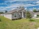 One-story home with gray siding, landscaping at 232 Samantha Ave, Auburndale, FL 33823