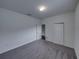 Bright bedroom with gray carpet and neutral wall color at 232 Samantha Ave, Auburndale, FL 33823