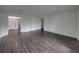 Spacious living room with wood-look floors at 232 Samantha Ave, Auburndale, FL 33823