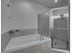 Bathroom features a soaking tub and a separate shower stall at 232 Samantha Ave, Auburndale, FL 33823