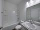 Clean bathroom featuring a tub, toilet, and vanity with sink at 232 Samantha Ave, Auburndale, FL 33823