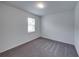 Simple bedroom with carpeted floor and neutral wall color at 232 Samantha Ave, Auburndale, FL 33823