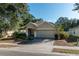 One-story house with a two-car garage and well-maintained lawn at 4067 Sw 46Th Ter, Ocala, FL 34474