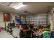 Garage with lawnmower and other storage items at 4067 Sw 46Th Ter, Ocala, FL 34474