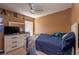 Bedroom with a blue bed and dresser at 4067 Sw 46Th Ter, Ocala, FL 34474