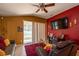 Spacious living room featuring a large TV and comfortable seating at 4067 Sw 46Th Ter, Ocala, FL 34474