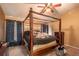 Main bedroom with a large four-poster bed at 4067 Sw 46Th Ter, Ocala, FL 34474