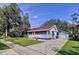 House exterior view with driveway and detached garage at 1938 E Fern Rd, Lakeland, FL 33801