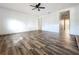 Living room with hardwood floors and access to hallway and bathroom at 1938 E Fern Rd, Lakeland, FL 33801