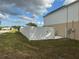 Side yard with white vinyl fence and access gate at 5018 Strada Dr, Winter Haven, FL 33880
