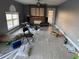Living room with fireplace and a large window at 5018 Strada Dr, Winter Haven, FL 33880