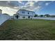 Large backyard with grassy lawn and two-story house at 5018 Strada Dr, Winter Haven, FL 33880