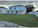 Home's backyard, featuring a grassy area at 5018 Strada Dr, Winter Haven, FL 33880
