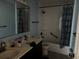 Bathroom with double vanity, shower, and bathtub at 5018 Strada Dr, Winter Haven, FL 33880