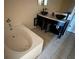 Bathroom with a bathtub and double sink vanity at 5018 Strada Dr, Winter Haven, FL 33880