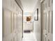 Bathroom with double closets and white vanity at 2002 Amesbury Dr, Auburndale, FL 33823