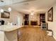 Open concept Gathering room with kitchen views and fireplace at 2002 Amesbury Dr, Auburndale, FL 33823