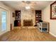 Gathering room with stone fireplace and built-in shelves at 2002 Amesbury Dr, Auburndale, FL 33823