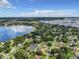 Aerial view of lakefront community with lush green landscape at 2002 Amesbury Dr, Auburndale, FL 33823