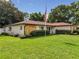 Ranch style home with landscaped lawn at 2002 Amesbury Dr, Auburndale, FL 33823