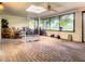 Brick floor sunroom with windows and ceiling fan at 2002 Amesbury Dr, Auburndale, FL 33823