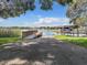 Private lake access with a dock and boathouse at 2002 Amesbury Dr, Auburndale, FL 33823