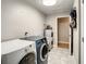 Laundry room with washer, dryer, and storage at 2002 Amesbury Dr, Auburndale, FL 33823