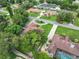 Aerial view of a residential area near a lake at 2002 Amesbury Dr, Auburndale, FL 33823