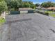 Overlooking a cracked asphalt tennis and basketball court at 2002 Amesbury Dr, Auburndale, FL 33823