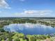Peaceful lake view with homes and lush surroundings at 2002 Amesbury Dr, Auburndale, FL 33823