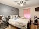 Bright bedroom with a ceiling fan and large windows at 2002 Amesbury Dr, Auburndale, FL 33823
