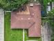 Top-down view of a house with brown roof and surrounding yard at 2002 Amesbury Dr, Auburndale, FL 33823