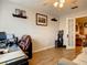 Home office with built-in shelving and hardwood floors at 2002 Amesbury Dr, Auburndale, FL 33823