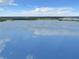 Stunning lake view with clear reflection of clouds at 2002 Amesbury Dr, Auburndale, FL 33823
