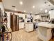 Modern kitchen with white cabinets, granite counters & island at 2002 Amesbury Dr, Auburndale, FL 33823