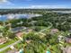 Aerial view showcasing lakefront homes and landscape at 2002 Amesbury Dr, Auburndale, FL 33823