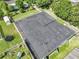 Aerial view of a multi-purpose sports court with basketball and tennis at 2002 Amesbury Dr, Auburndale, FL 33823