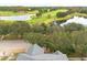 Close-up aerial view of house roof and surrounding trees at 3366 Cat Brier Trl, Harmony, FL 34773
