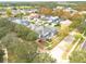House nestled in a tree-lined neighborhood near a golf course at 3366 Cat Brier Trl, Harmony, FL 34773
