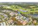 Aerial view of home on golf course community with lake views at 3366 Cat Brier Trl, Harmony, FL 34773