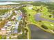 Home's location shown in an aerial view near golf course at 3366 Cat Brier Trl, Harmony, FL 34773