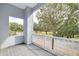 Private balcony overlooking tree-lined street at 3366 Cat Brier Trl, Harmony, FL 34773