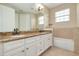 Bathroom with double vanity and granite countertop at 3366 Cat Brier Trl, Harmony, FL 34773