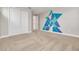 Bedroom with geometric wall art and carpet flooring at 3366 Cat Brier Trl, Harmony, FL 34773