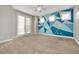 Bedroom with colorful accent wall and carpet at 3366 Cat Brier Trl, Harmony, FL 34773