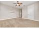 Bedroom with floating shelves and ceiling fan at 3366 Cat Brier Trl, Harmony, FL 34773