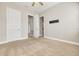 Bright bedroom with neutral walls and carpet flooring, access to bathroom at 3366 Cat Brier Trl, Harmony, FL 34773