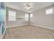 Bright bedroom with neutral walls and carpet flooring at 3366 Cat Brier Trl, Harmony, FL 34773