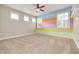 Bedroom with pastel rainbow wall and carpet at 3366 Cat Brier Trl, Harmony, FL 34773