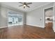 Bedroom with hardwood floors and sliding glass doors leading to the pool at 3366 Cat Brier Trl, Harmony, FL 34773